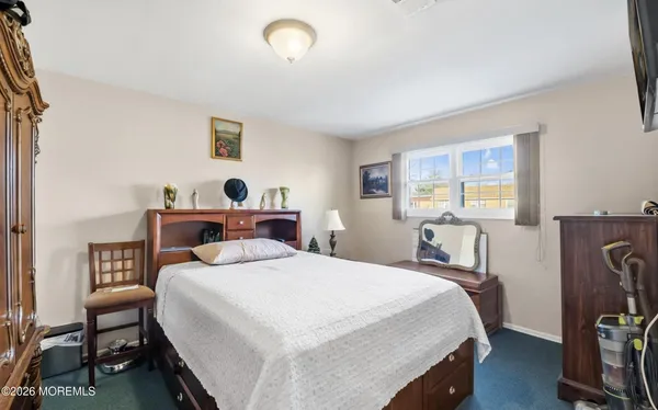 a bedroom with a bed and a table in it