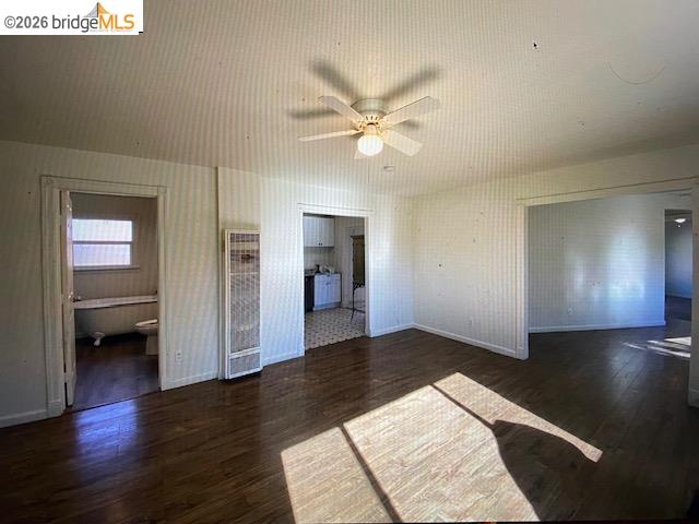 230 Cleaveland Road Pleasant Hill, CA 94523 - Photo 6 of 8 a view of a hallway with wooden floor and a ceiling fan