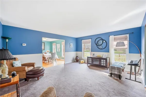a living room with furniture and a table