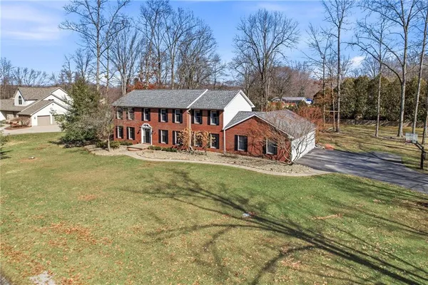 a view of a house with a yard porch and sitting area