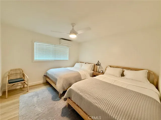 a bedroom with a bed and a mirror