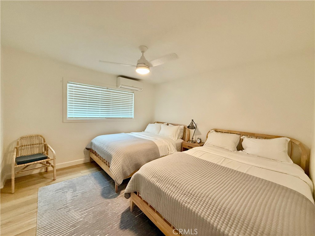 730 Via Altamira Montebello, CA 90640 - Photo 18 of 27 a bedroom with two beds and a chair