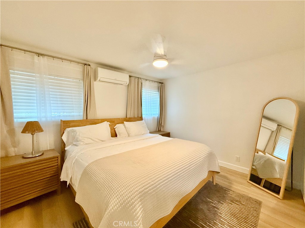 730 Via Altamira Montebello, CA 90640 - Photo 26 of 27 a bedroom with a bed a window with wooden floor