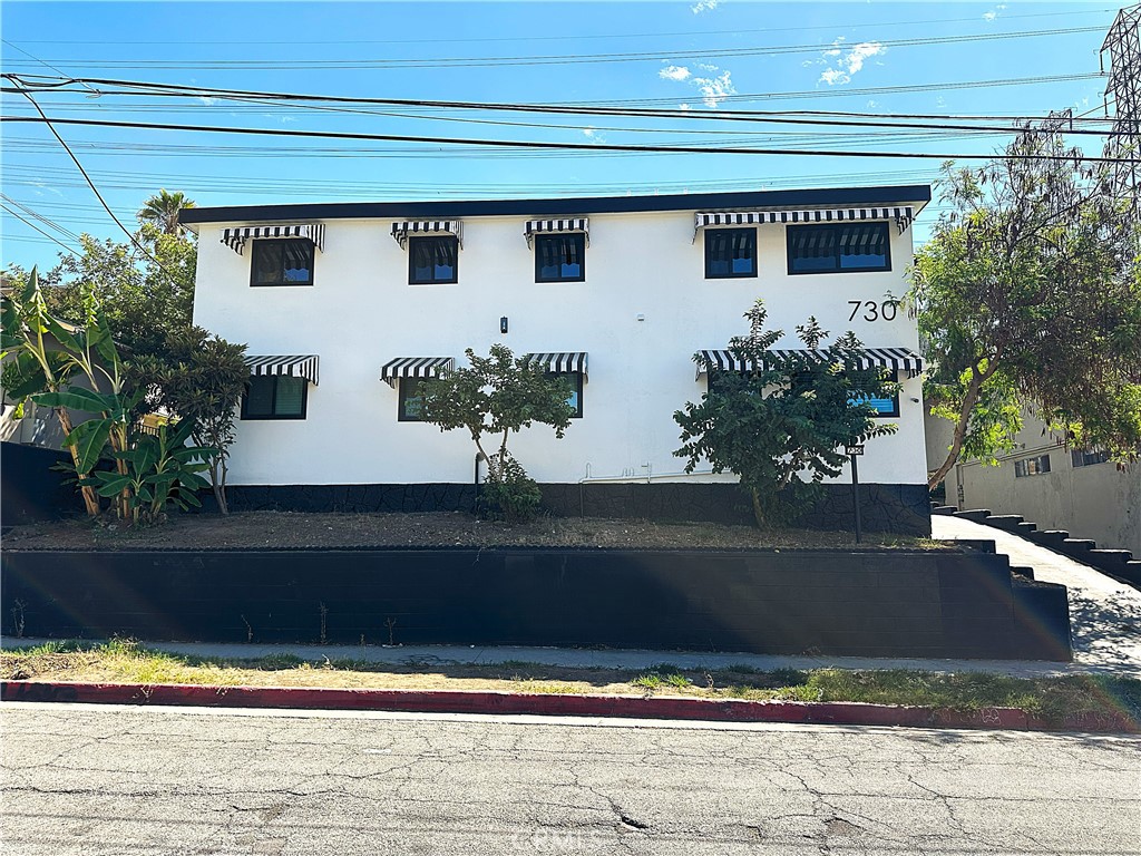 730 Via Altamira Montebello, CA 90640 - Photo 3 of 27 a potted plant sitting on the side of a building