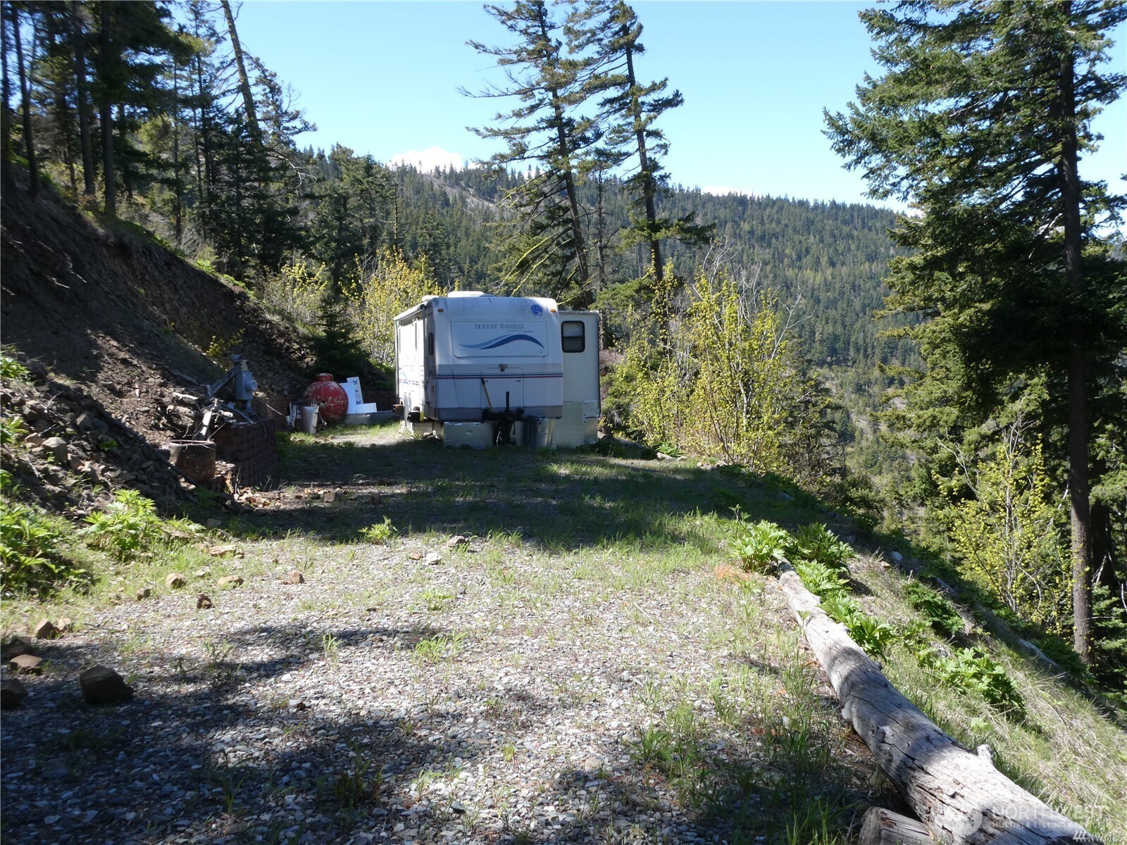 831 Horse Heaven Road Cle Elum, WA 98922 - Photo 11 of 32 a backyard of a house with yard and outdoor seating