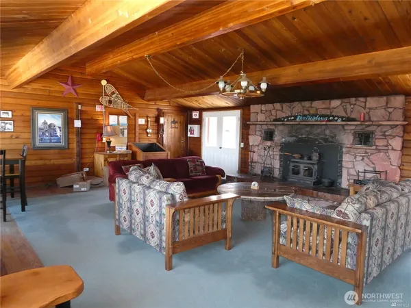 a kitchen with a large window in it and outdoor seating