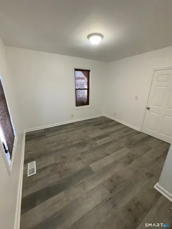 an empty room with a empty space and window