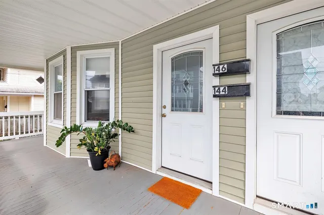 a view of a entryway door front of a house