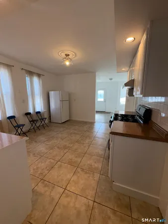 a view of a kitchen with a sink and cabinets