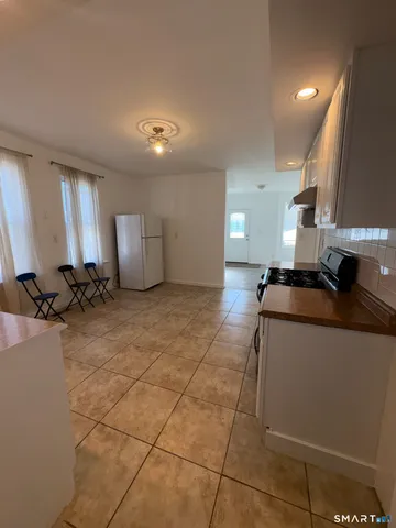 a view of a kitchen with a sink and cabinets