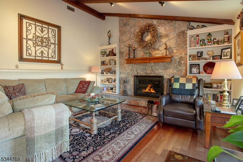 5 Marine Terrace Sparta, NJ 07871 - Photo 13 of 48 a living room with furniture and a fireplace
