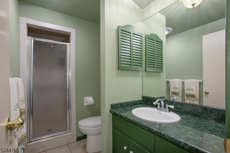 5 Marine Terrace Sparta, NJ 07871 - Photo 23 of 48 a bathroom with a granite countertop toilet sink and mirror