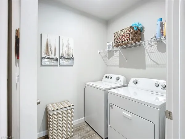 a utility room with dryer and washer