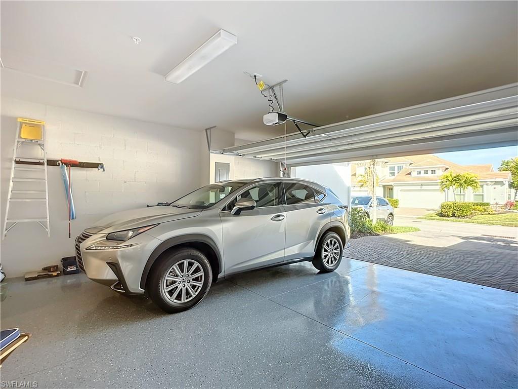 4664 Arboretum Circle, Unit 101 Naples, FL 34112 - Photo 37 of 48 a view of a car in garage