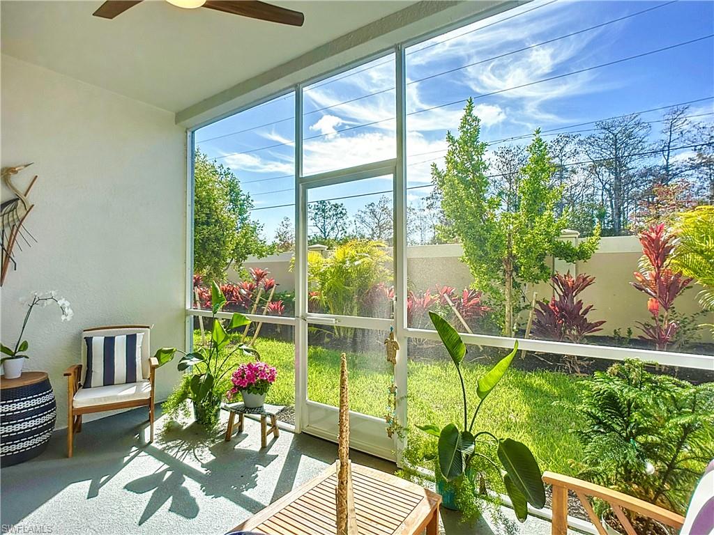 4664 Arboretum Circle, Unit 101 Naples, FL 34112 - Photo 39 of 48 a living room filled with furniture