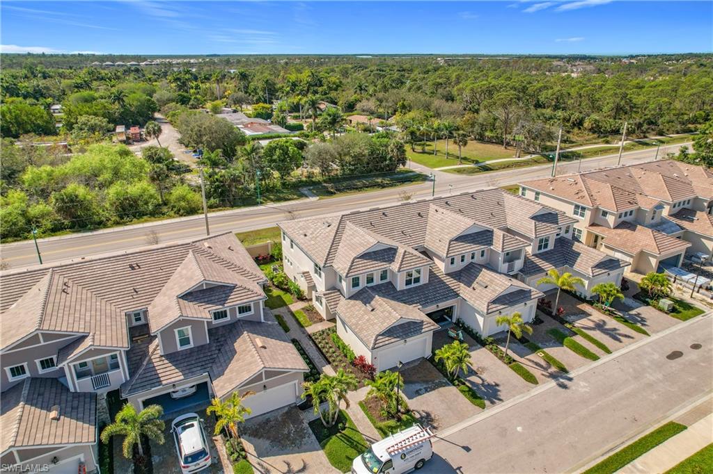 4664 Arboretum Circle, Unit 101 Naples, FL 34112 - Photo 45 of 48 a view of an outdoor space with seating area
