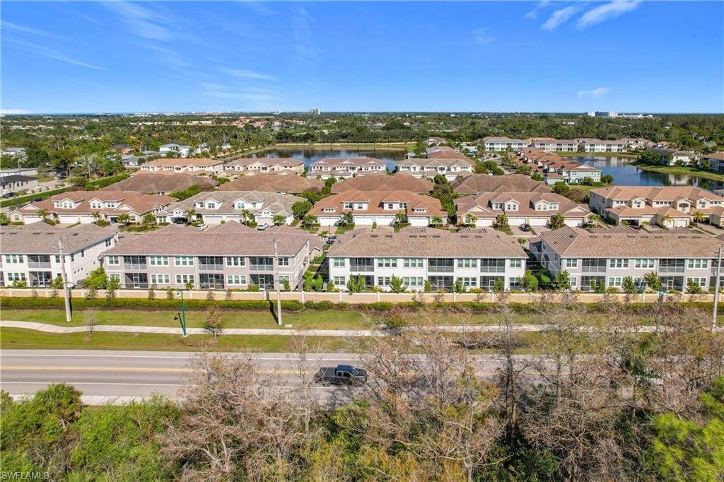 4664 Arboretum Circle, Unit 101 Naples, FL 34112 - Photo 46 of 48 a view of city with tall buildings
