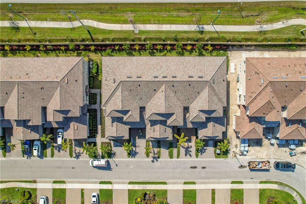 4664 Arboretum Circle, Unit 101 Naples, FL 34112 - Photo 47 of 48 a view of building with an ocean