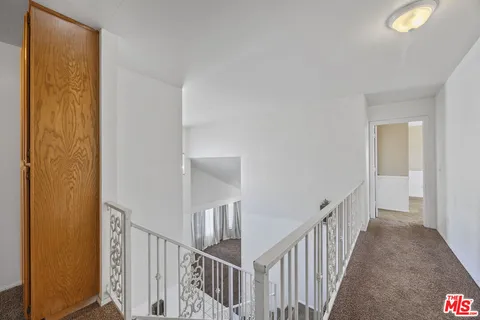 a view of a hallway with a window