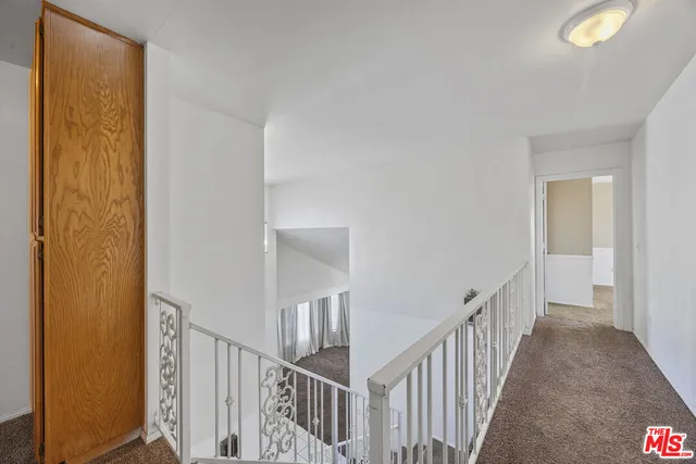 a view of a hallway with a window