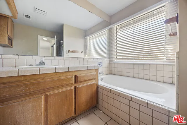 a bathroom with a bathtub and a sink