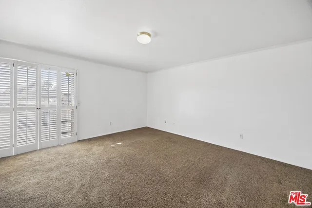 an empty room with sliding door