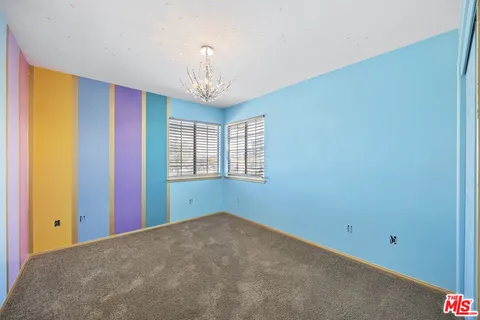 a view of a room with a large window