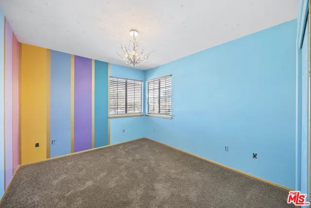 a view of a room with a large window