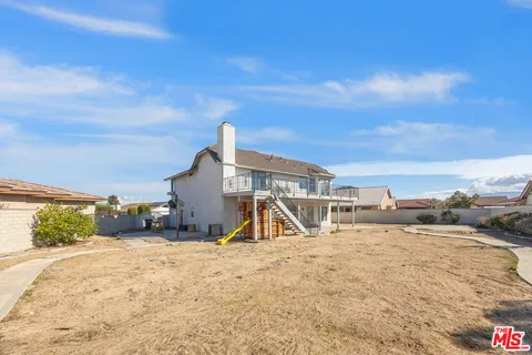 a view of a swimming pool with a yard