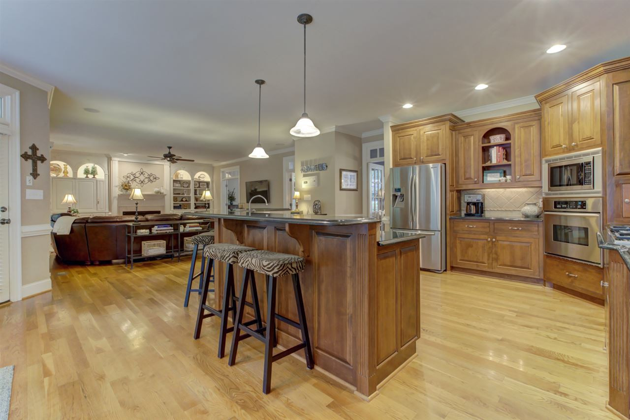 1009 Quiet Ridge Circle Raleigh, NC 27614 - Photo 30 of 30 This view of Gourmet Kitchen shows wonderful open floor plan. Center Island with eat in counter for casual meals Kitchen