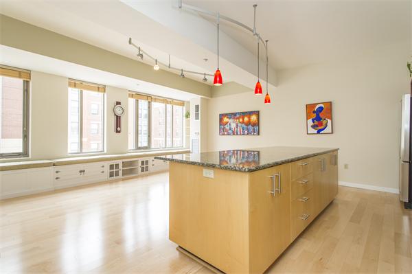 1313 Washington Street, Unit 310 Boston, MA 02118 - Photo 3 of 14 a view of a kitchen with furniture and a window