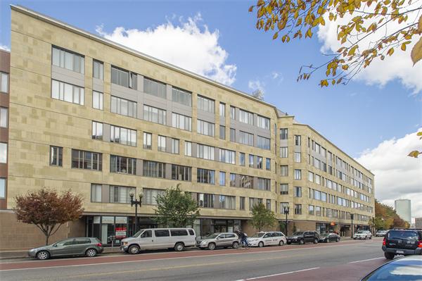 1313 Washington Street, Unit 310 Boston, MA 02118 - Photo 9 of 14 a front view of a building with lot of cars and trees