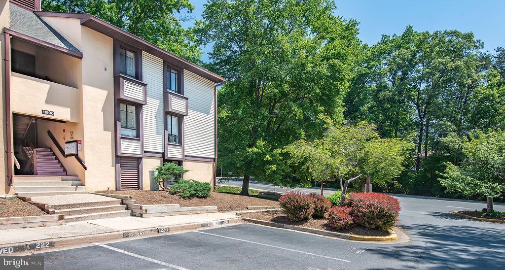 11600 Stoneview Square, Unit 60/2B Reston, VA 20191 - Photo 24 of 27 a building exterior with furniture