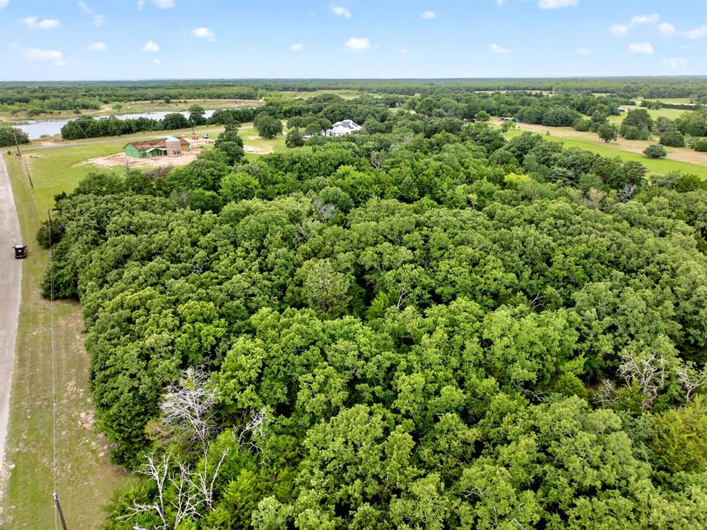 Tbd Woodland Estates Road Terrell, TX 75160 - Photo 7 of 22 an aerial view of residential houses with outdoor space and trees