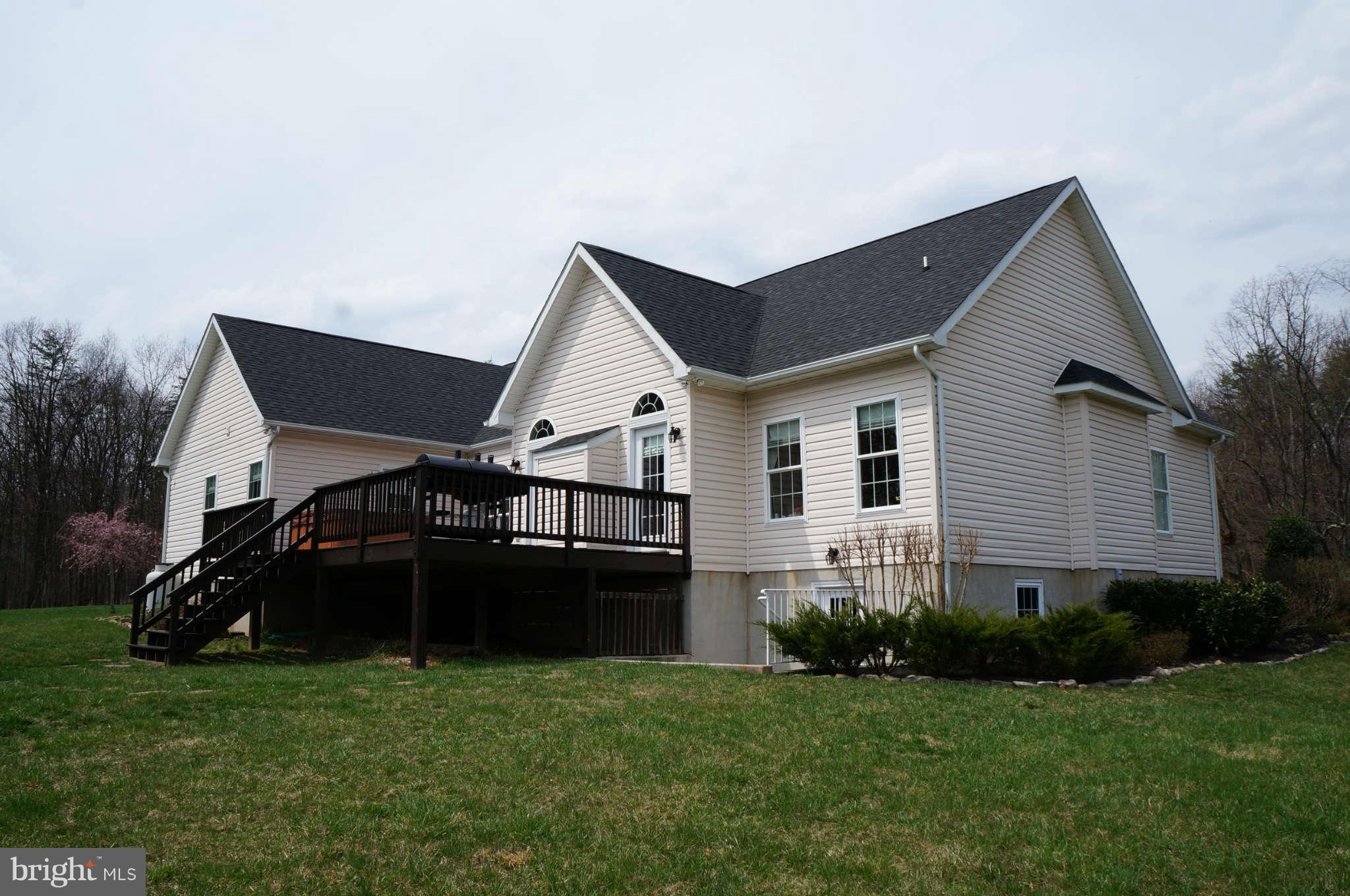 251 Ridgeview Road Gore, VA 22637 - Photo 3 of 21 a front view of a house with a garden