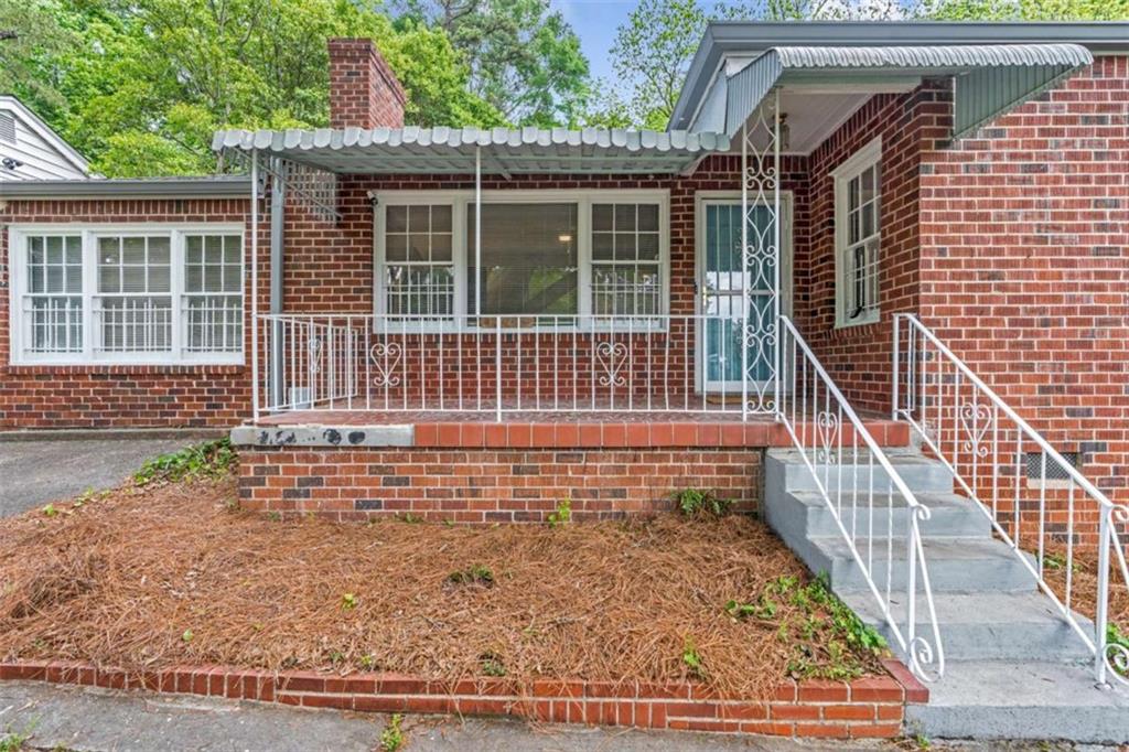 1766 Brewer Boulevard Southwest Atlanta, GA 30310 - Photo 1 of 30 a view of house with wooden floor and a potted plant