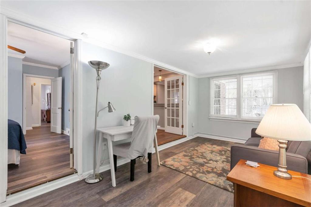 1766 Brewer Boulevard Southwest Atlanta, GA 30310 - Photo 13 of 30 a living room with furniture a table and a large window