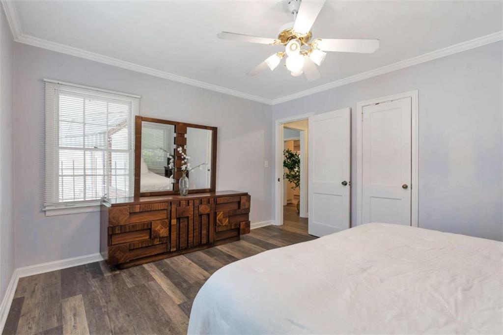 1766 Brewer Boulevard Southwest Atlanta, GA 30310 - Photo 17 of 30 a bedroom with a bed dresser and a window