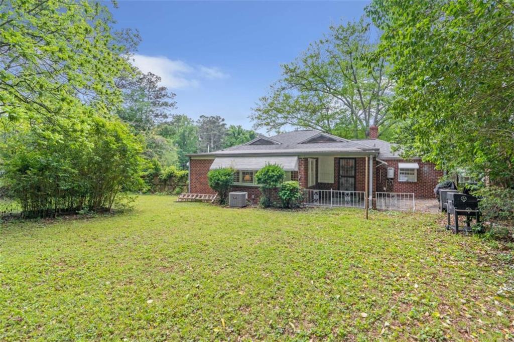 1766 Brewer Boulevard Southwest Atlanta, GA 30310 - Photo 23 of 30 a front view of a house with a garden