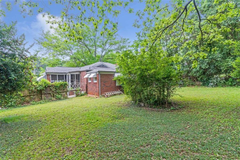 1766 Brewer Boulevard Southwest Atlanta, GA 30310 - Photo 24 of 30 a front view of a house with yard and green space