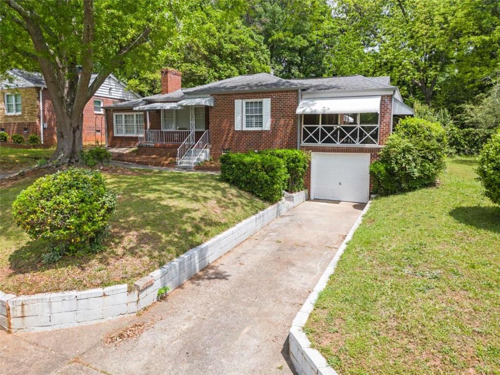 1766 Brewer Boulevard Southwest Atlanta, GA 30310 - Photo 28 of 30 a front view of a house with garden