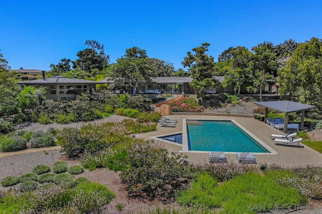 1615 Lugano Lane Del Mar, CA 92014 - Photo 1 of 25 a green field covered with tall trees