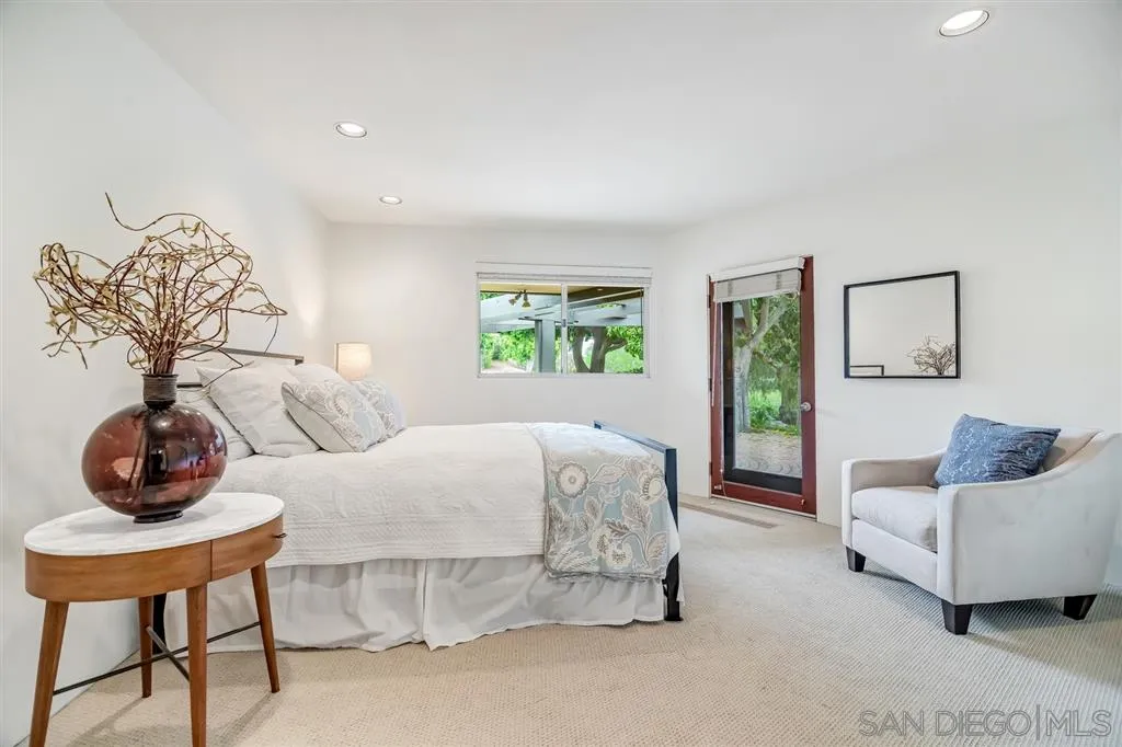 1615 Lugano Lane Del Mar, CA 92014 - Photo 12 of 25 a bedroom with furniture and a window