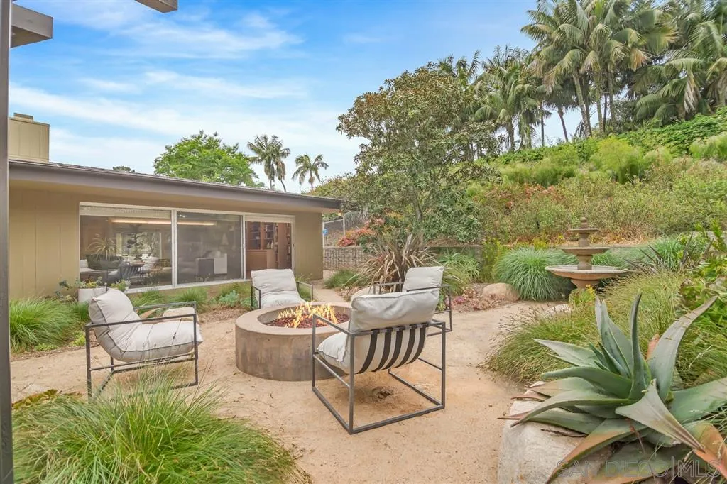 1615 Lugano Lane Del Mar, CA 92014 - Photo 16 of 25 a view of a patio with couches table and chairs and potted plants