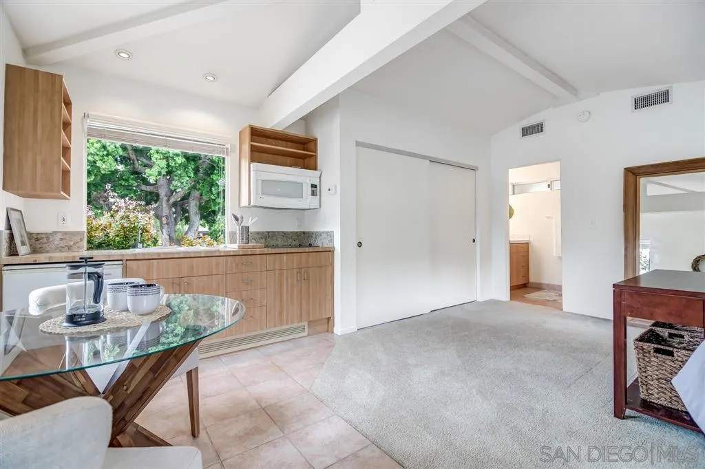 1615 Lugano Lane Del Mar, CA 92014 - Photo 17 of 25 a living room with furniture and a large window