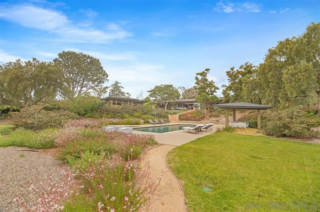 1615 Lugano Lane Del Mar, CA 92014 - Photo 20 of 25 a view of a swimming pool with an ocean view
