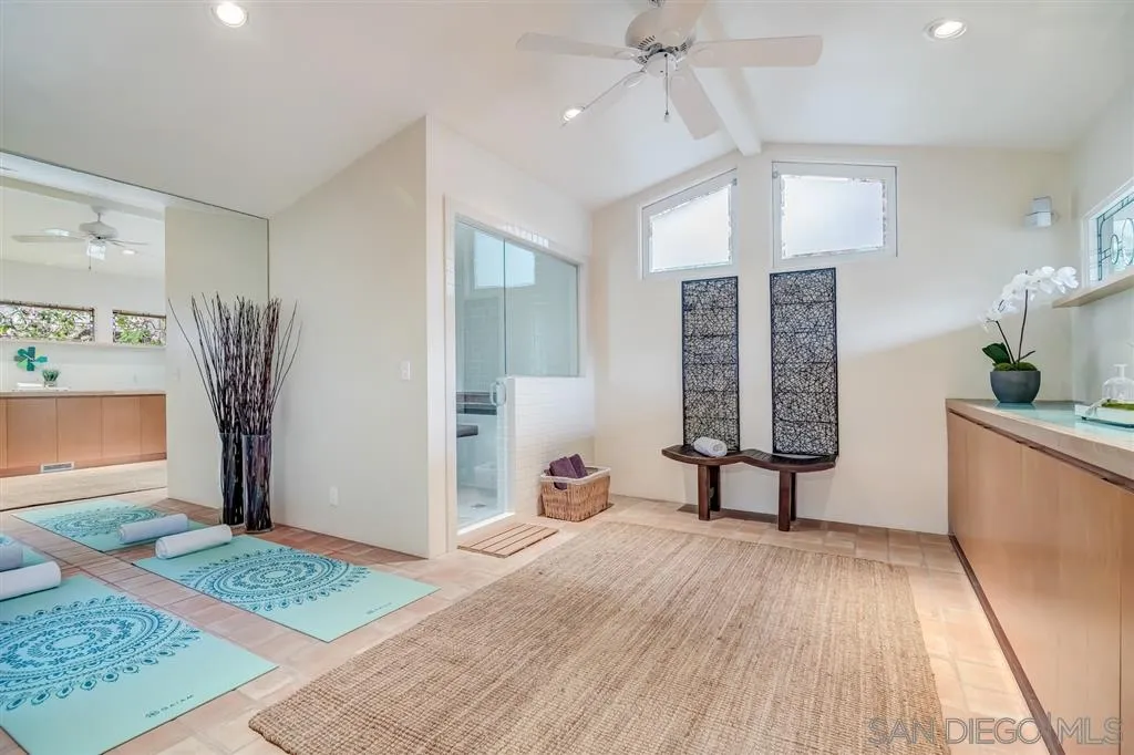 1615 Lugano Lane Del Mar, CA 92014 - Photo 8 of 25 a spacious bedroom with a bed and a dresser