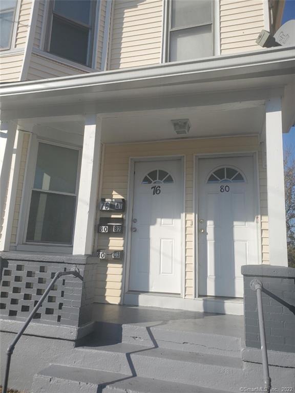 76 Commercial Street, Unit 1 Bridgeport, CT 06604 - Photo 1 of 9 a view of a living room and entry way