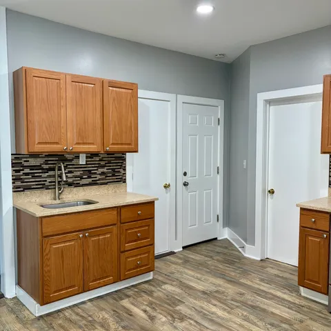 a kitchen with stainless steel appliances granite countertop a stove and a refrigerator