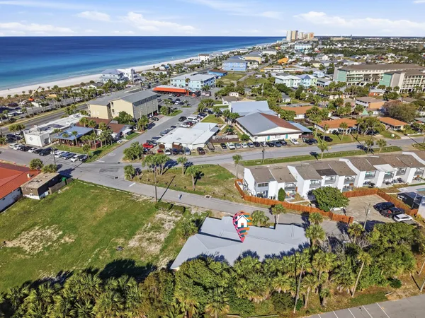 an aerial view of residential houses with outdoor space